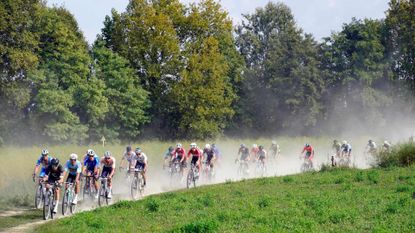 The pack rides during the first edition of the UCI Gravel World Championships 2022 between Vicenza and Cittadella, northern Italy on October 9, 2022. (Photo by Massimo Fulgenzi / AFP) (Photo by MASSIMO FULGENZI/AFP via Getty Images)