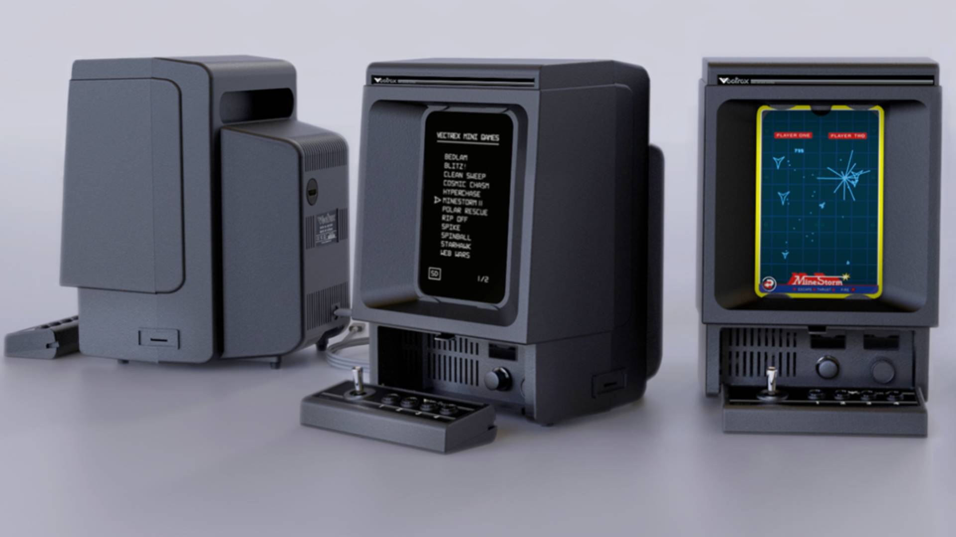 Vectrex Mini consoles next to controllers with grey backdrop.