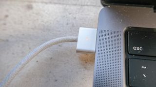 The MacBook Pro 2021 (14-inch)'s plugged in MagSafe 3 port