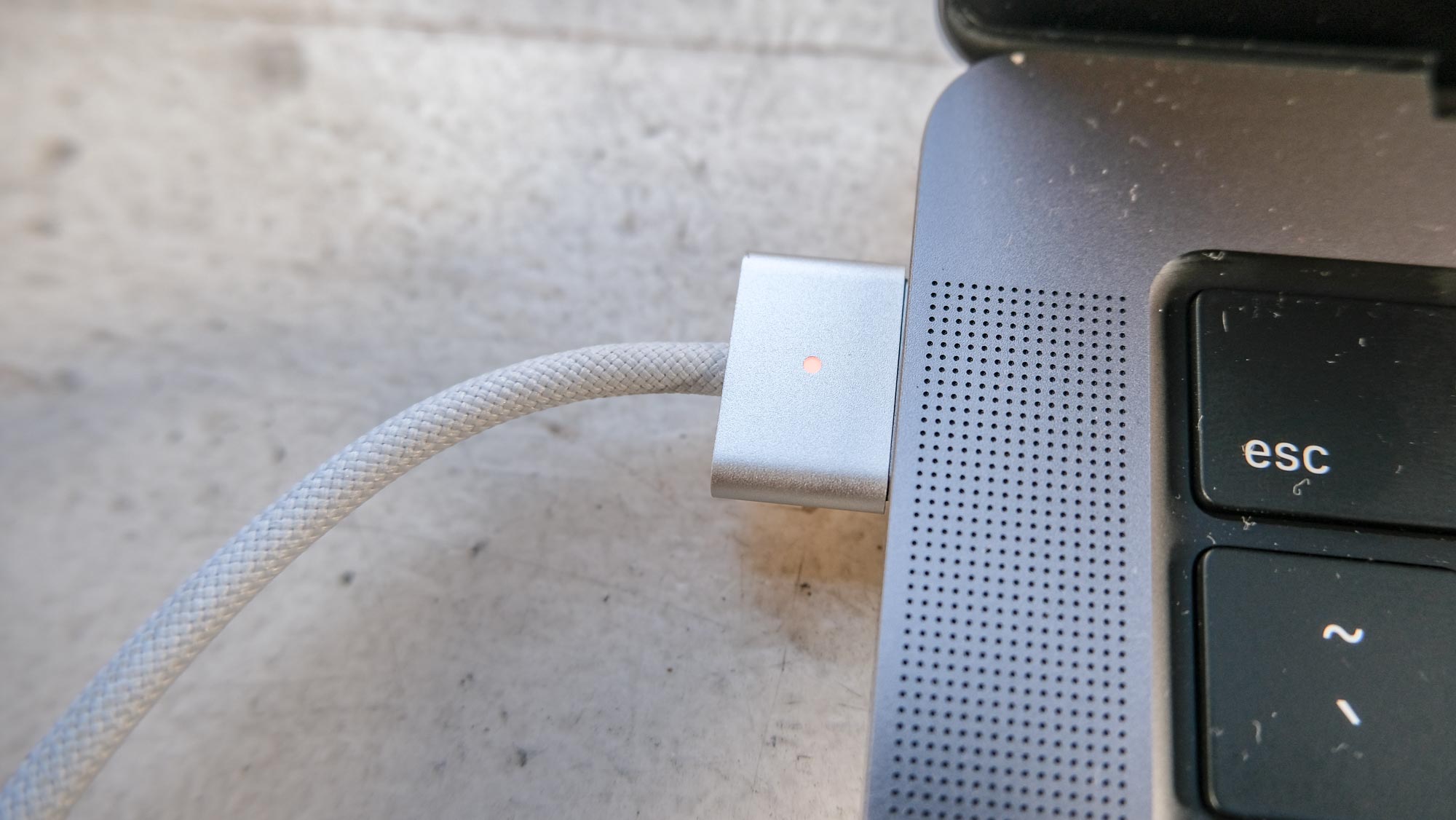 The MacBook Pro 2021 (14-inch)'s plugged in MagSafe 3 port