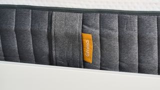 A close up of the Emma tag on the side of the Emma Elite Mattress