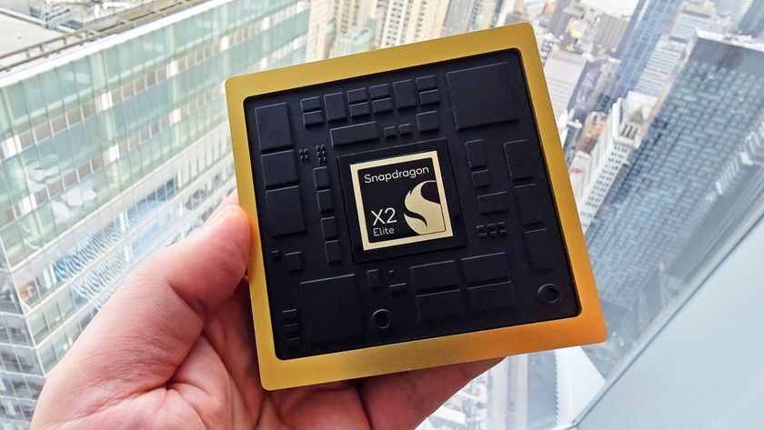 Qualcomm's new X2 Elite processor marketing prop being held by a window.