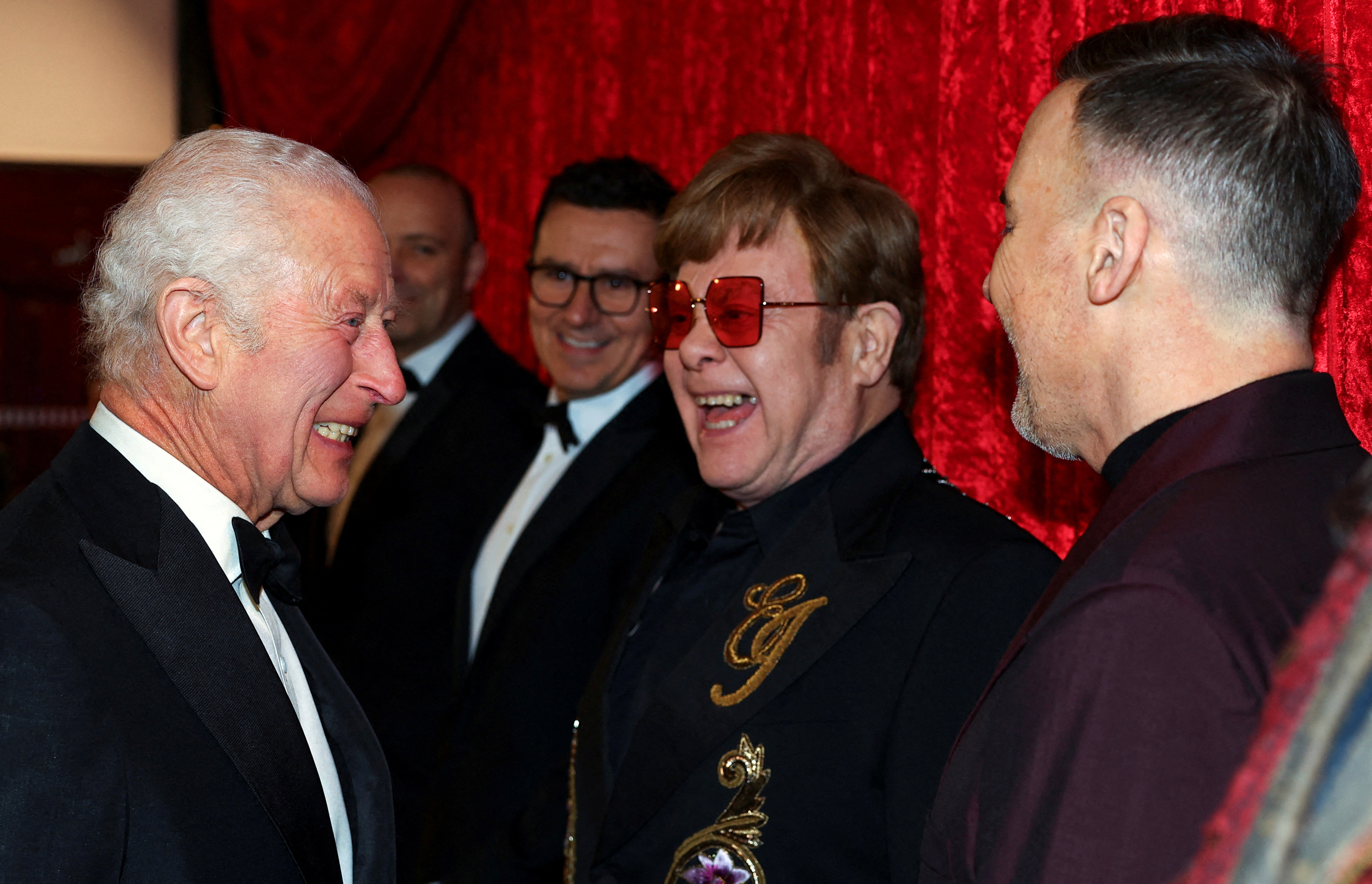 King Charles laughing with Elton John at the Royal Variety Performance