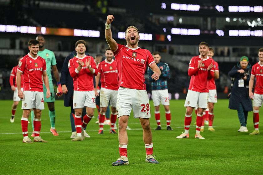 Sam Smith celebrates with Wrexham teammates