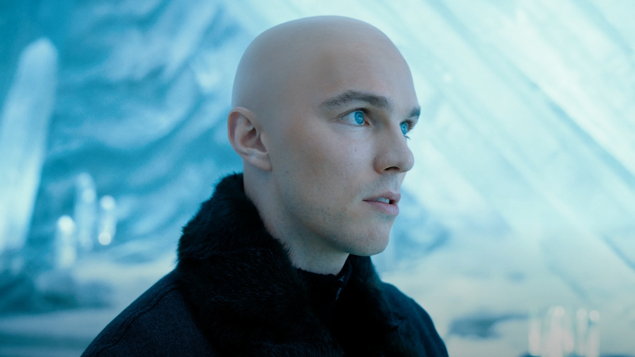 Lex Luthor, played by Nicholas Holt, standing in an icy room that is presumably at the Fortress of Solitude in Superman (2025).