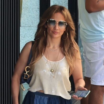 Jennifer Lopez wearing a sequin tank with a patchwork denim Dior skirt in Los Angeles September 2024