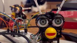 Skinned furby hooked up to a raspberry pi.