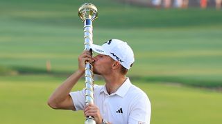 Nicolai Hojgaard kissing the DP World Tour Championship trophy