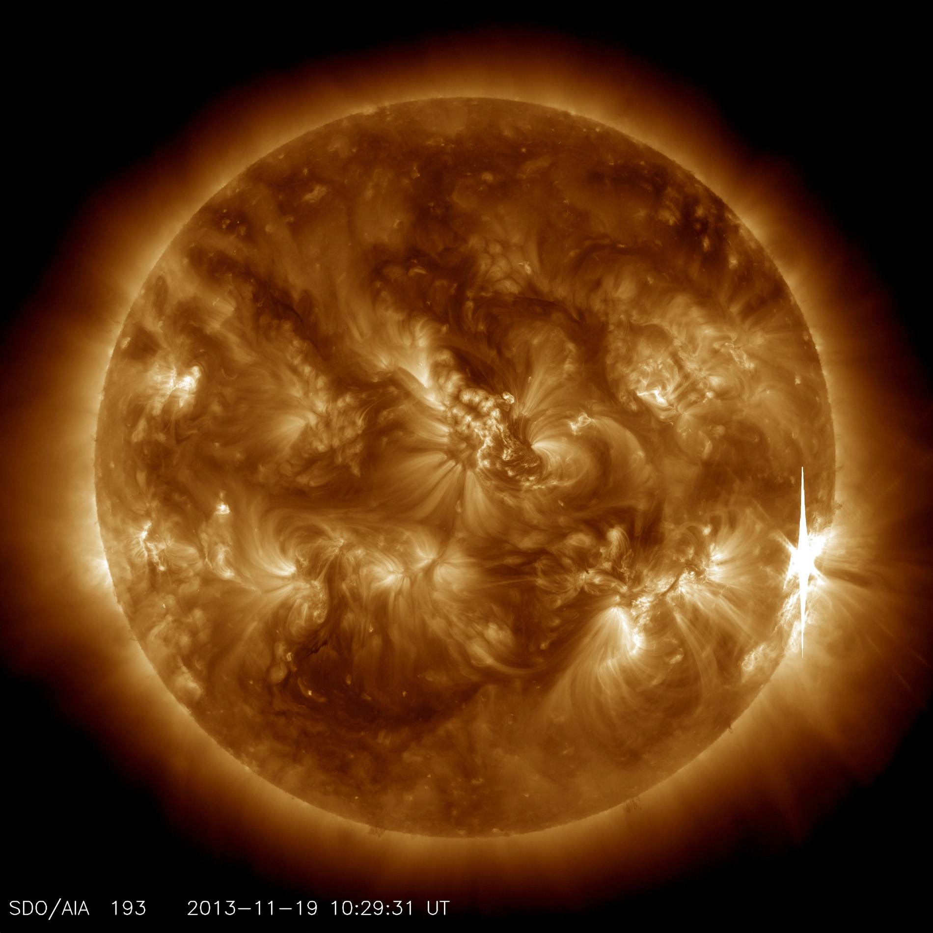 An X1-class flare erupts from the right side of the sun in this image captured by NASA&#039;s Solar Dynamics Observatory on Nov. 19, 2013. 