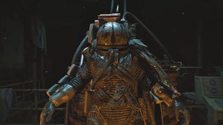 A hulking, rusted armored figure stands in a dim industrial room, its helmet and layered metal suit catching orange and blue light, creating an ominous sci-fi mood.