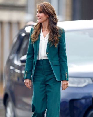 Kate Middleton wearing a green 70s style suit
