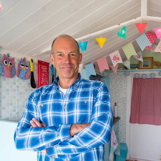 men with checked blue shirt white wooden roof bunting