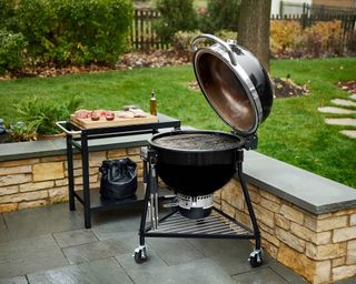 Weber Summit kamado charcoal grill on a patio