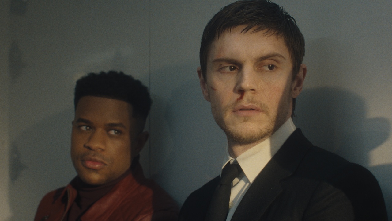 Jeremy and Cooper inside the back of a guarded vehicle in The Beauty Season 1