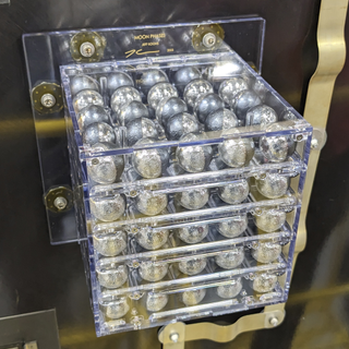 Jeff Koons Moon Phases artwork, stacked steel balls in clear cube