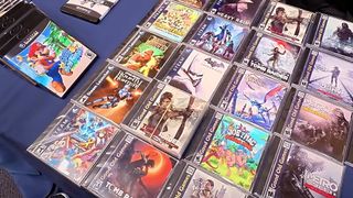 Table with custom physical PC games on blue cover.