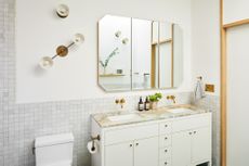 a white bathroom with a vanity 