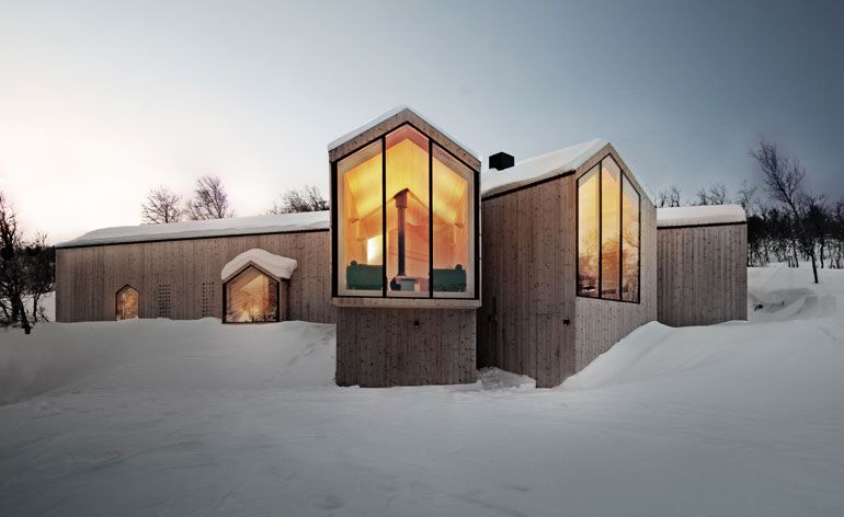 Mountain lodge in deep snow