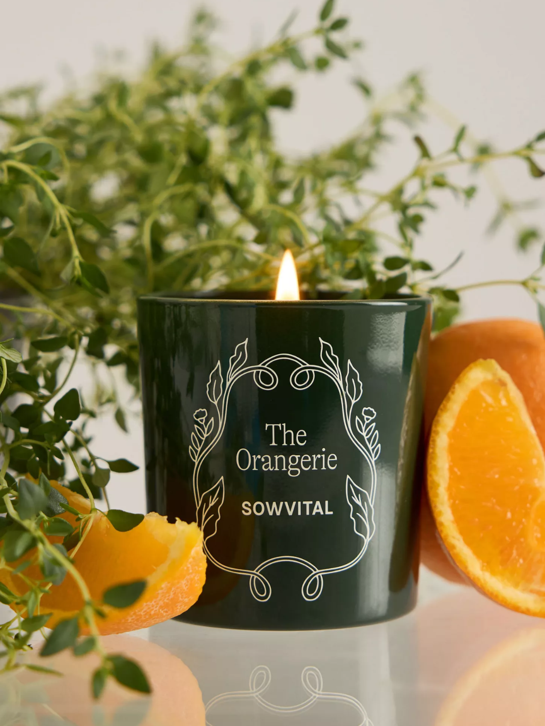 An orange scented green candle from Sowvital