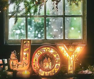 A Christmas monogram set spelling out 'JOY'.