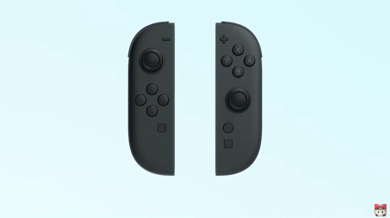 The Nintendo Switch 2 as shown in its announcement trailer with orange and blue accents and removeable controllers.