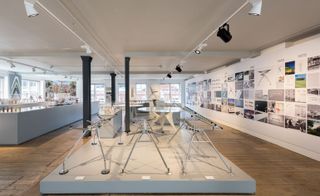 Lighting exhibition featuring design ideas and descriptions in a bright room with wooden floor