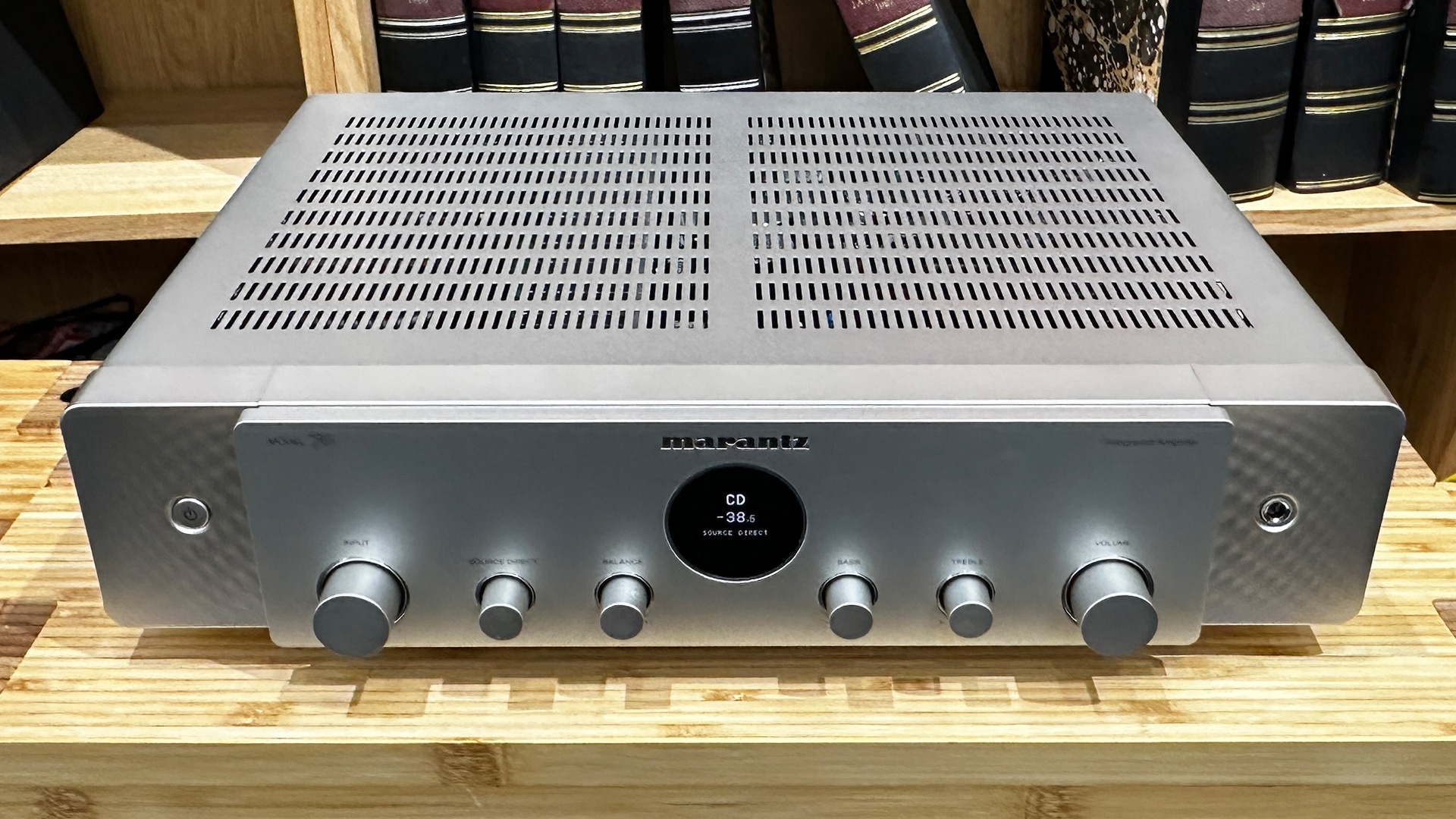 Marantz Model 70 integrated amplifier on wooden hi-fi rack in front of bookcase