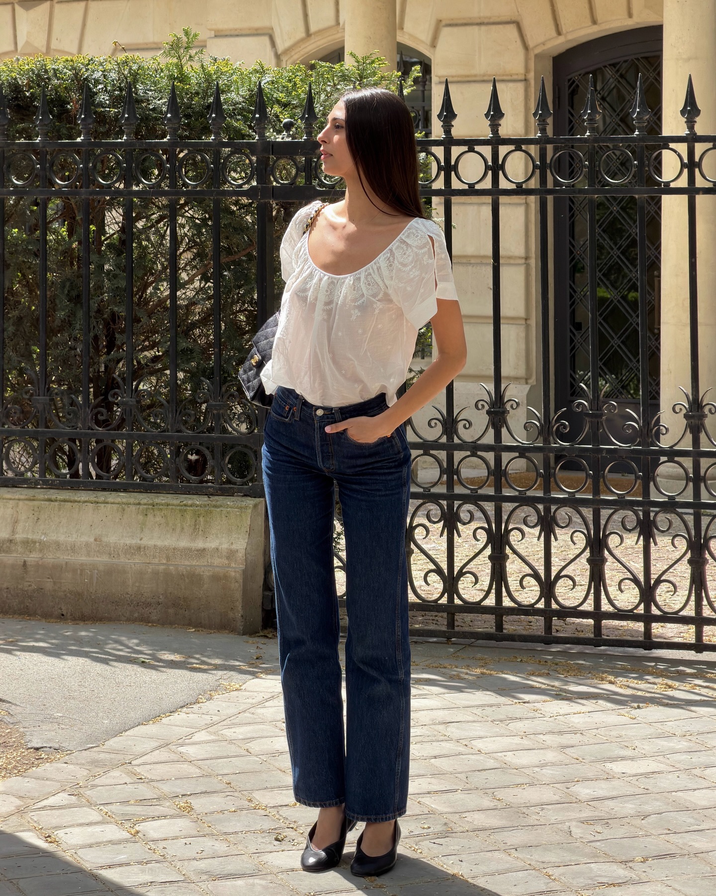 An image of @salome.mory wearing red jeans, one of the biggest summer jeans trends of 2026.