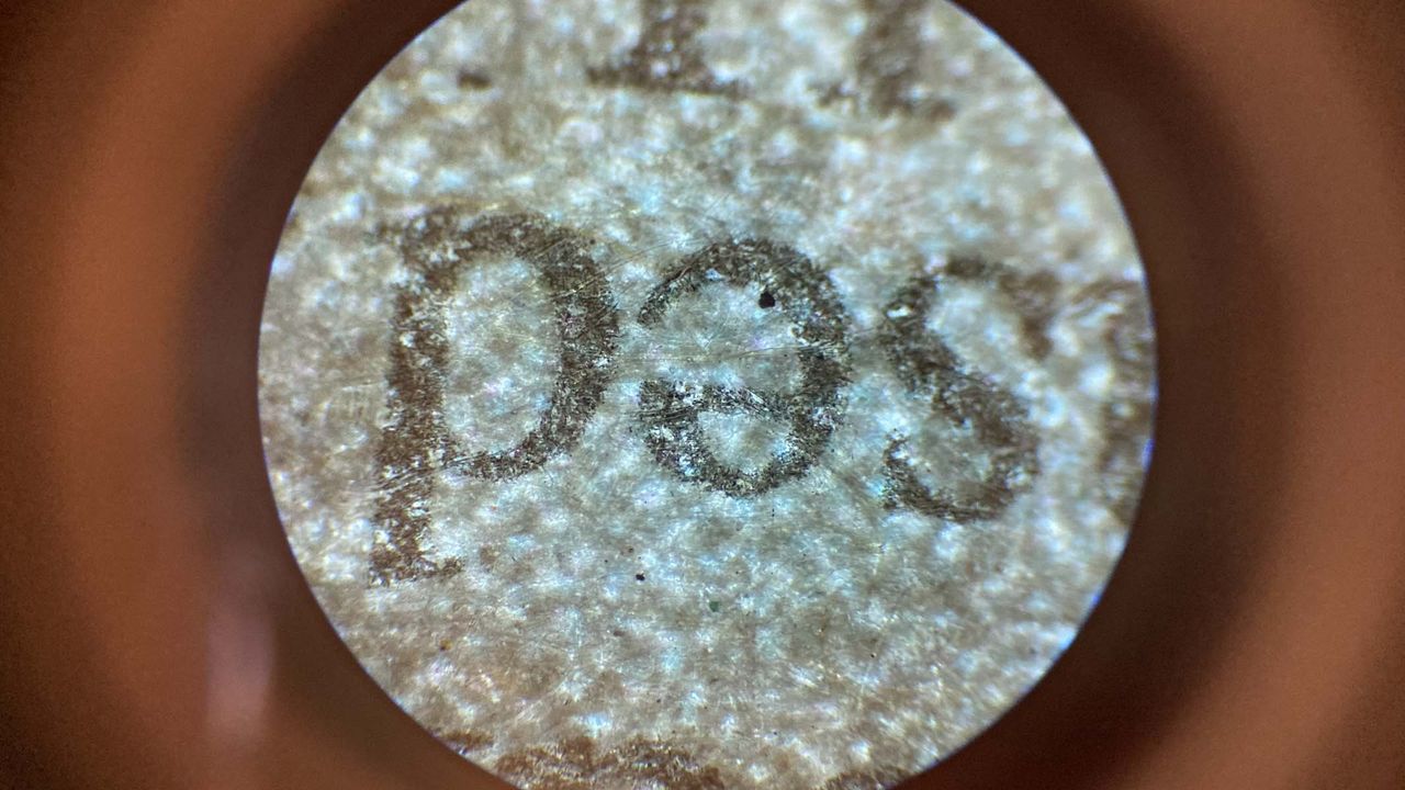 newspaper under a microscope