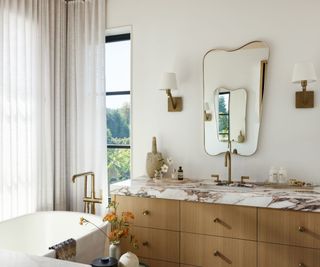 marble bathroom vanity and freestanding bath