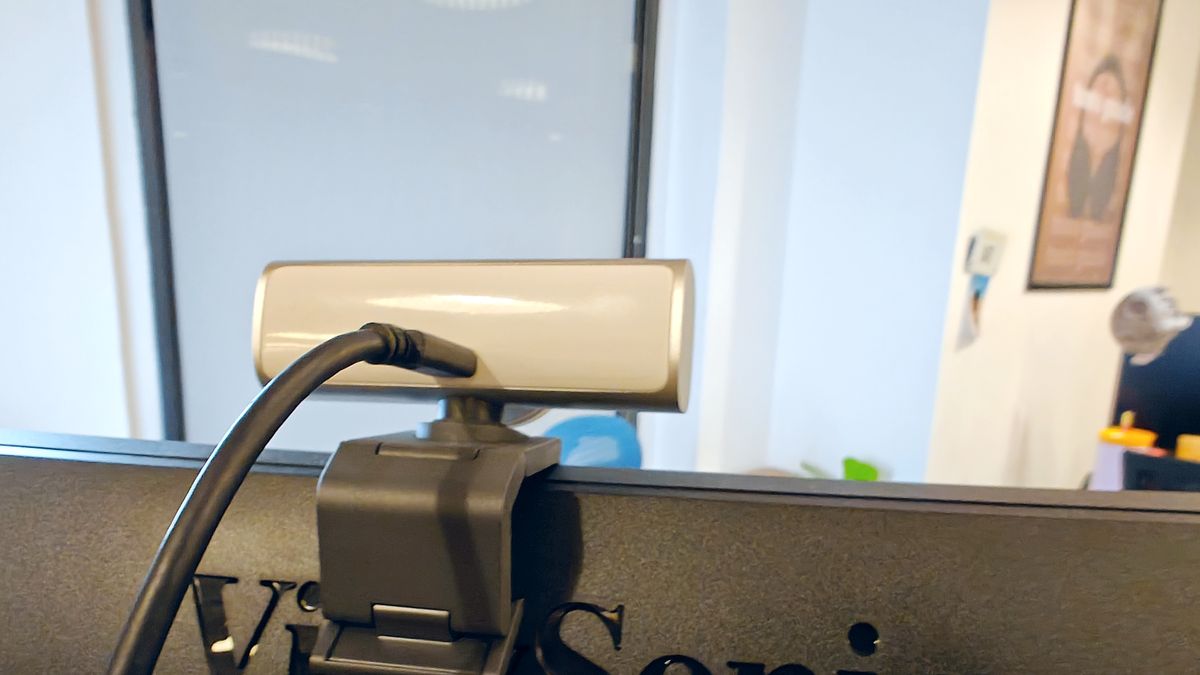 Back view of Logitech MX Brio 4K webcam mounted on a monitor with USB-C cable plugged in