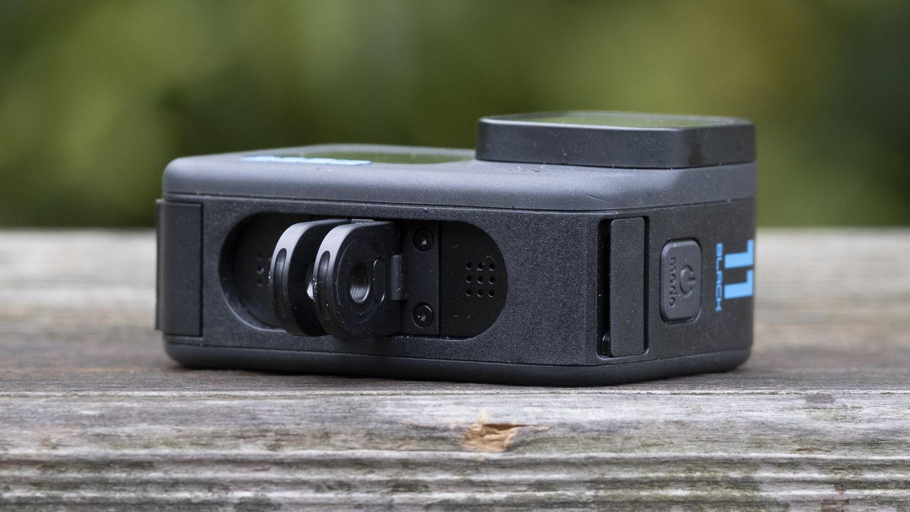 The GoPro Hero 11 Black action camera sitting on a wooden platform