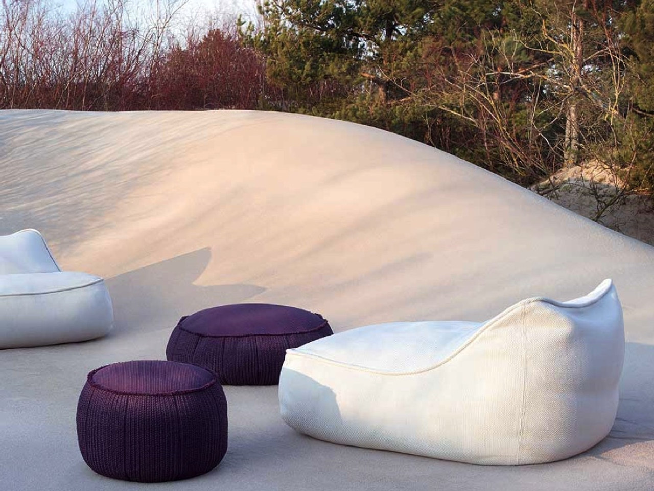 beanbags sit on sand dune