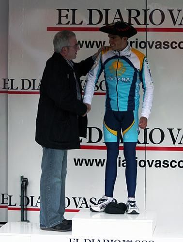 Alberto Contador (Astana) is congratulated on the podium.