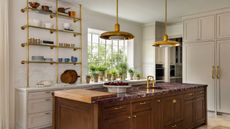 A white and wood kitchen decorated with wooden cutting boards