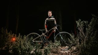 Sergio Layos stands with one of his Mondraker mountain bikes for 2023