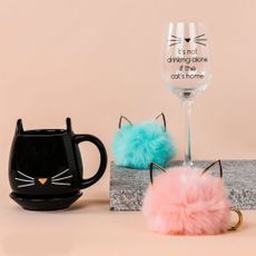 tea cup with cat design and wine glass