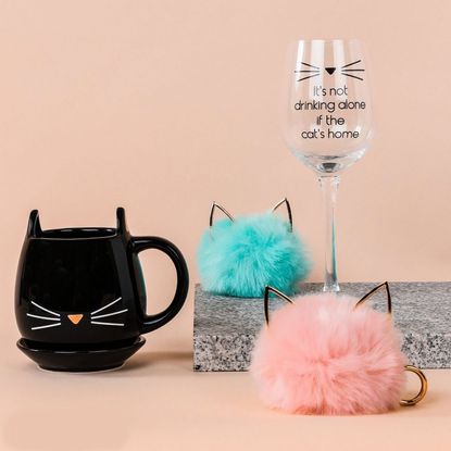 tea cup with cat design and wine glass