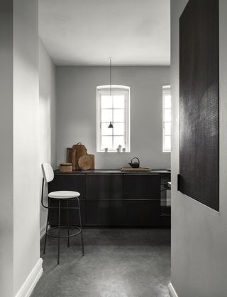 minimalist kitchen with white bar stool