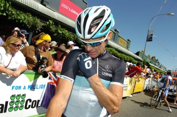 Is this Leopard Trek rider checking his radio or looking for his scarf?