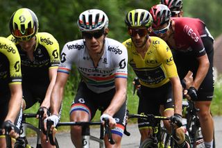 Adam Yates surrounded by teammates during stage 7 at Dauphine