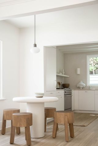 a dining table with stool seating