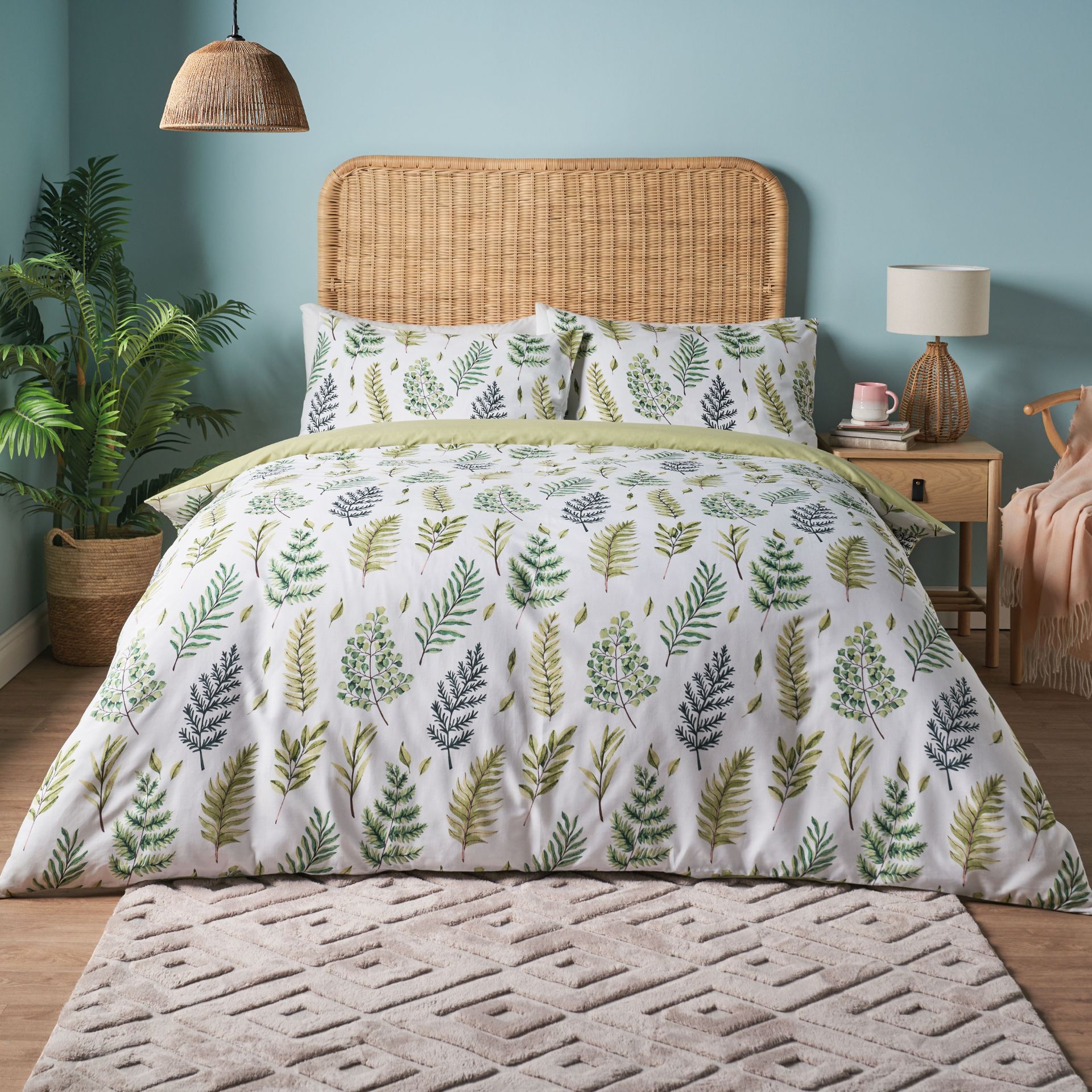 Cane rattan headboard with bed in springtime design, rug, and bedside table