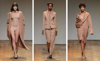 3 female models on the runway wearing nude coats & suits