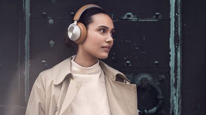 Bang & Olufsen Beoplay HX review: woman wearing premium over-ear headphones