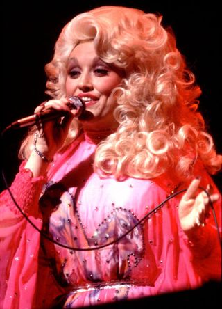 Dolly Parton in a pink country-inspired silk dress