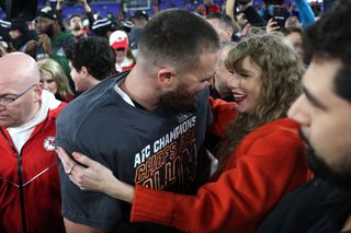 Taylor Swift and Travis Kelce on field after the Chiefs victory on January 28, 2024