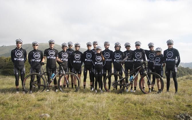 The Whole Athlete / Specialized team poses in their stealth team training kit