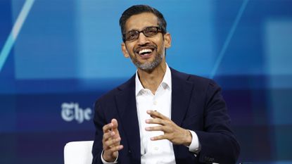 Google CEO Sundar Pichai pictured speaking on stage at the New York Times annual DealBook summit.