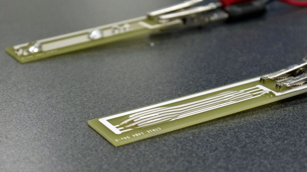 Water spreads out on an untreated circuit board